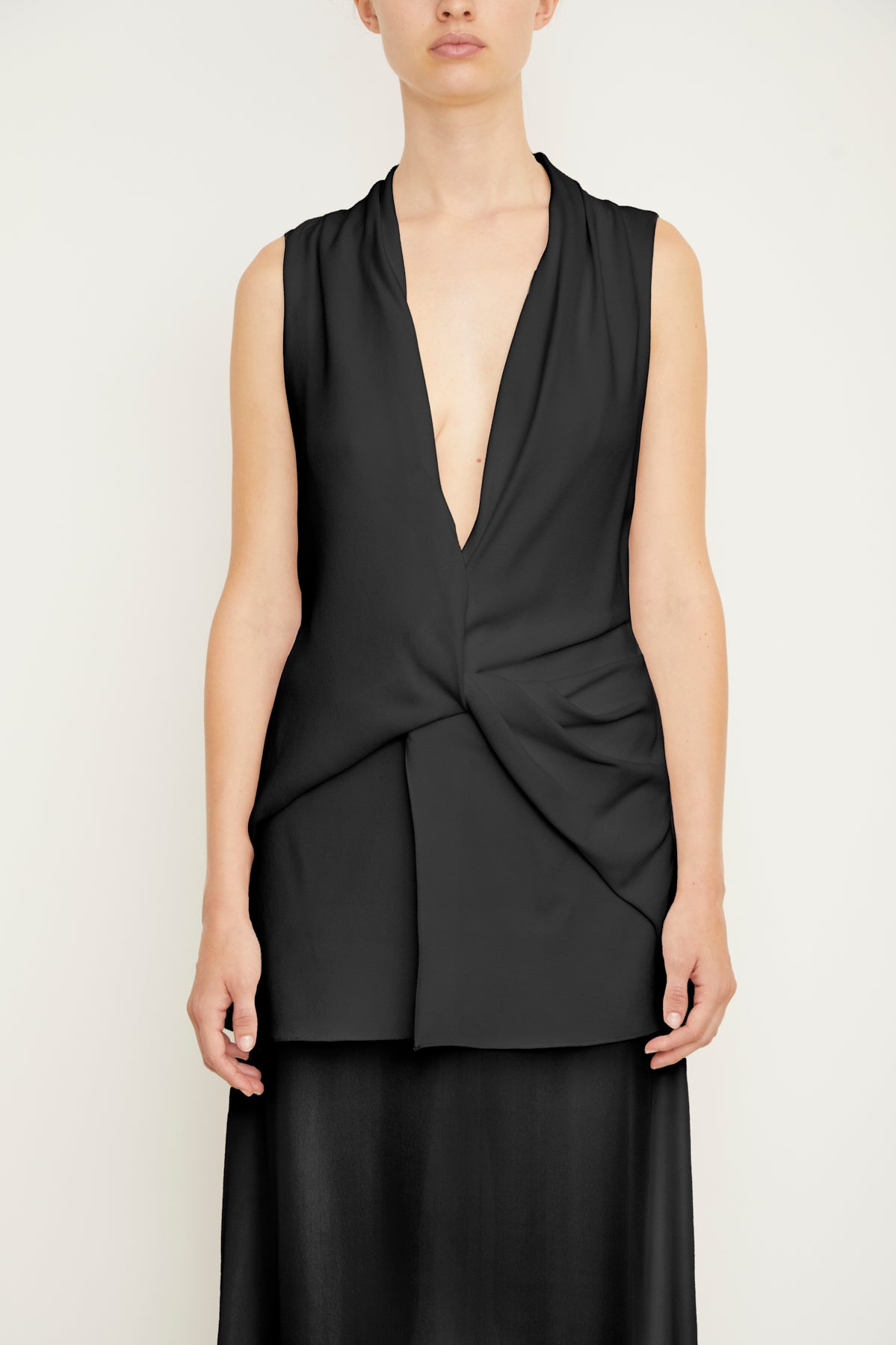 The Sutton Sleeveless Draped Dress with Sheer Skirt in Black