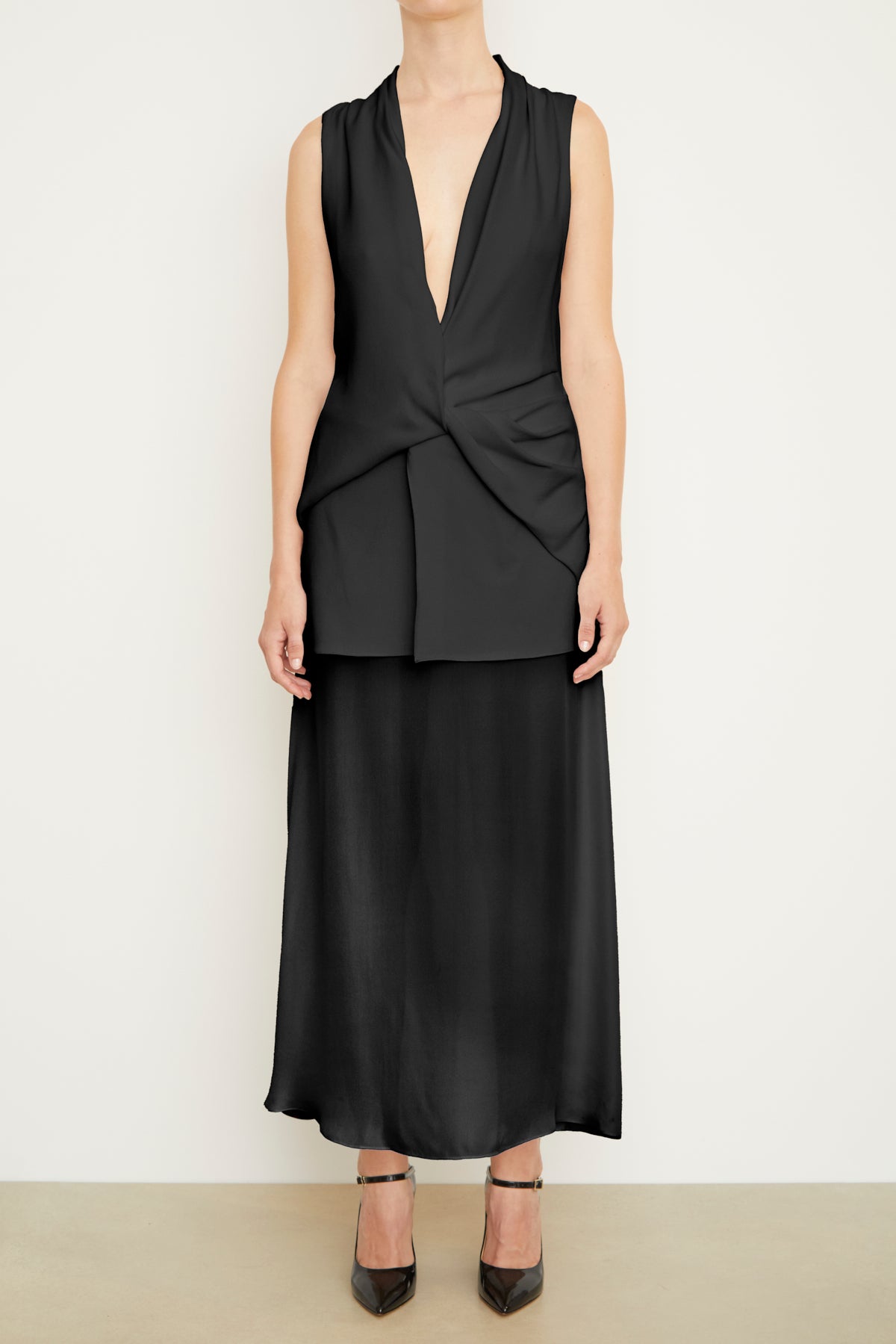 The Sutton Sleeveless Draped Dress with Sheer Skirt in Black