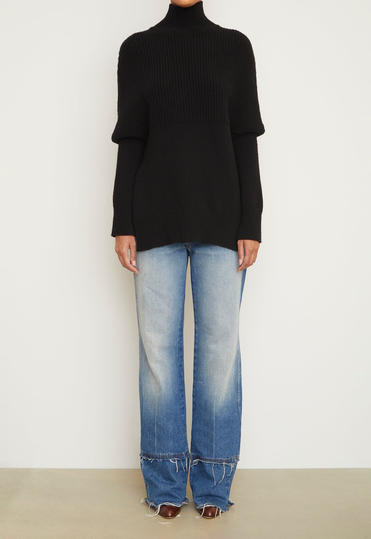 The Matea Cape Long Sleeve Turtleneck Sweater in Black