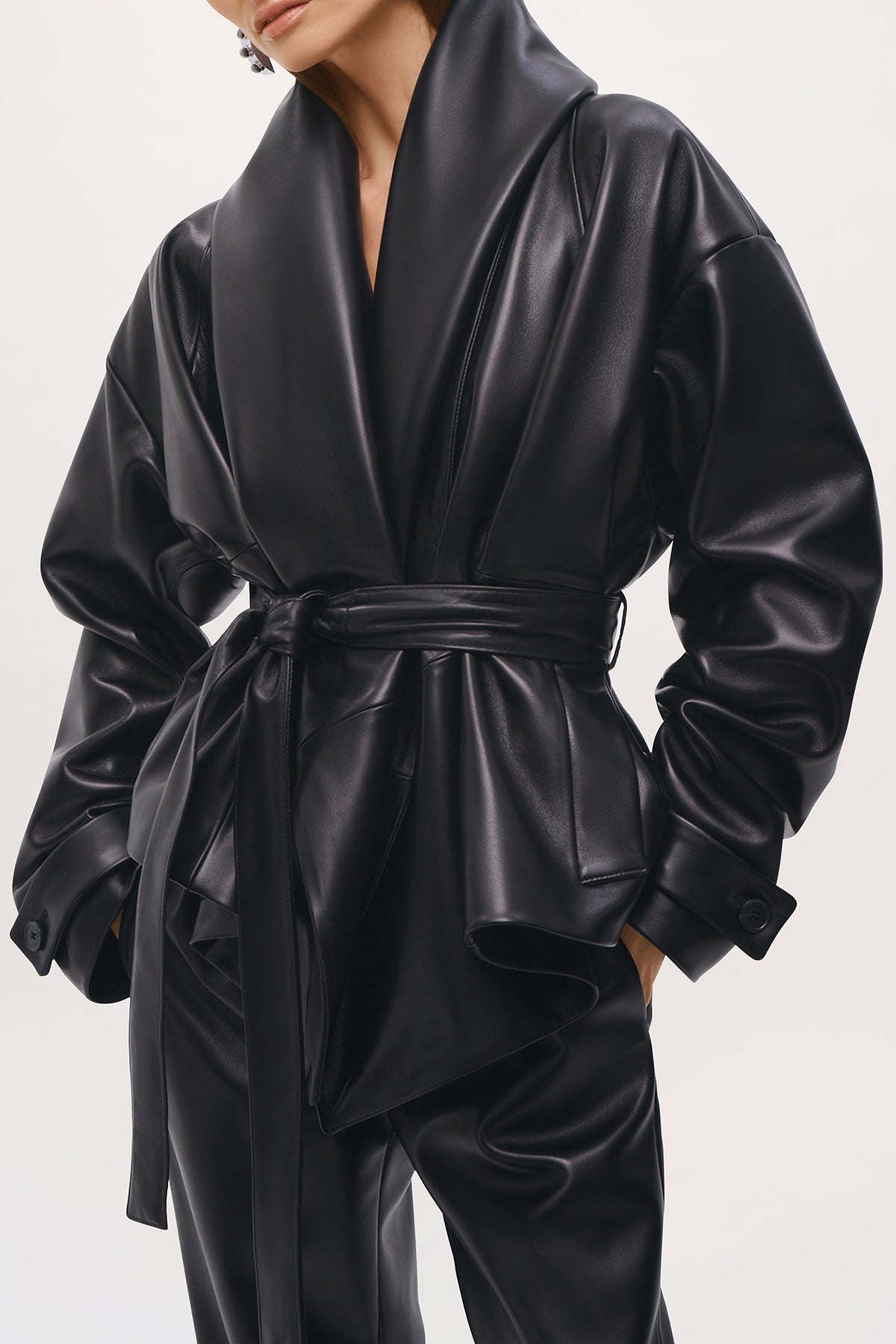 Close up side view of the Bennett Trench Coat in Black.