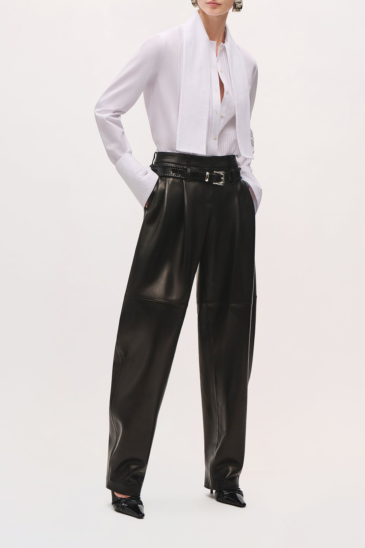 Angled front view of model wearing Inez Shirt in White, tucked into pants, with attached scarf. 