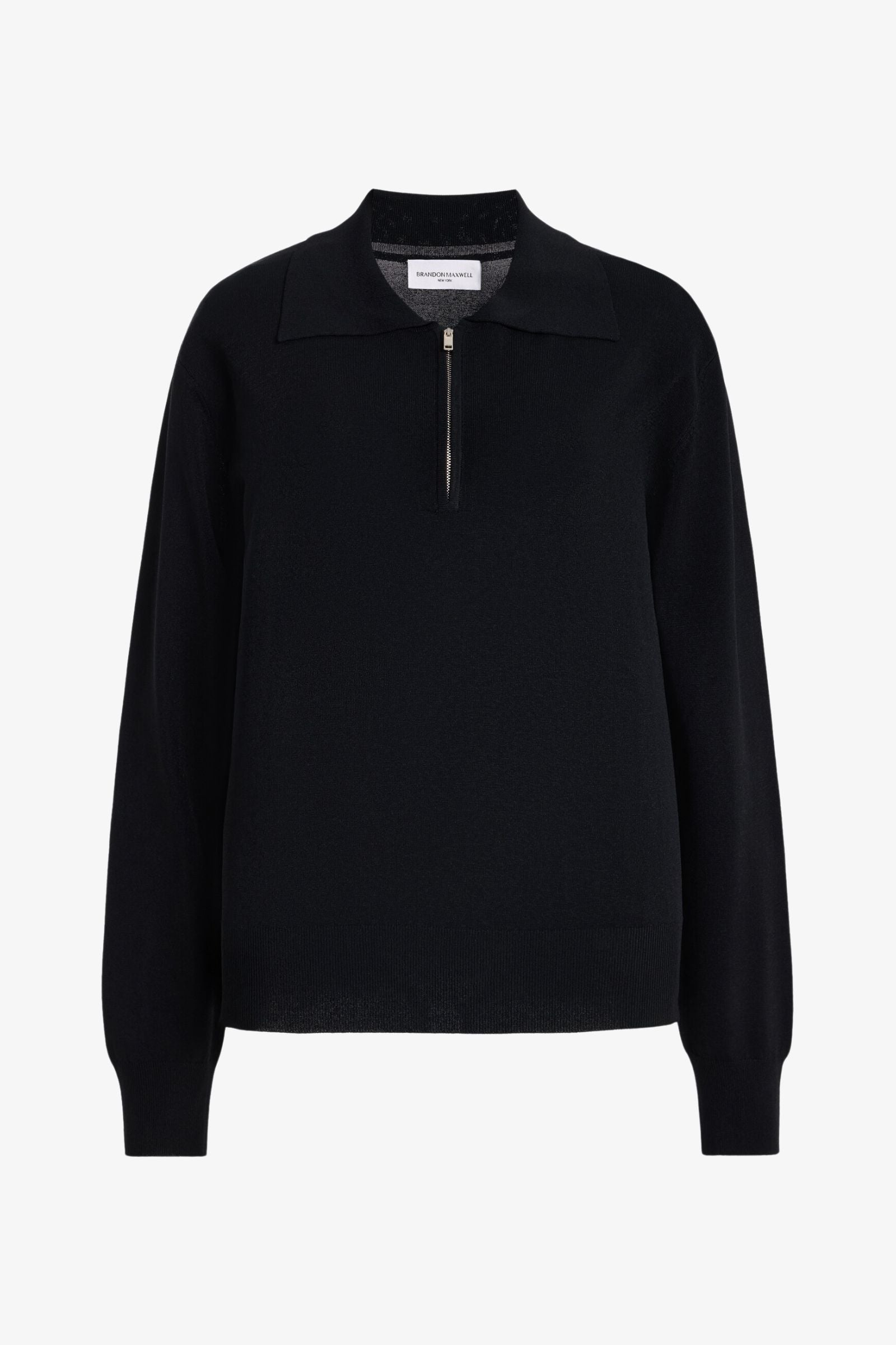 A black long-sleeve knit top with a mock neck and a short front zipper, displayed on a clean white background.