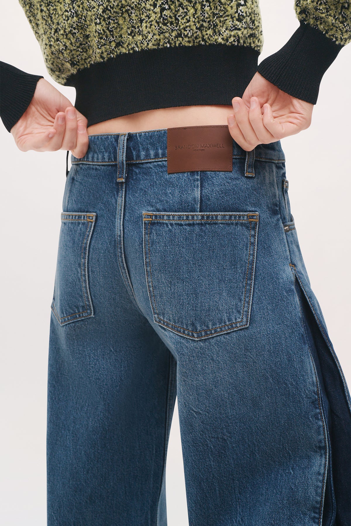 Angled back close-up of the Lana Trousers in Bi-Color Wash, highlighting the bi-color denim construction and wide-leg silhouette.